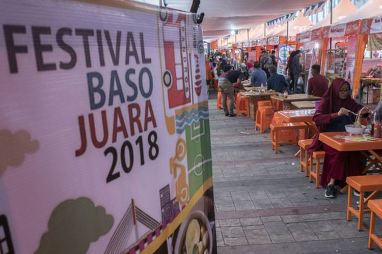 Festival Baso Juara 2018 - Festival banner wall with dining area and orange tables setup